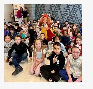 A class of kids posing after a reading